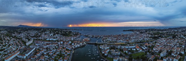 Panorama of Sunset over Saint-Jean-de-Luz from a drone, Nouvelle-Aquitaine, Pyrenees-Atlantiques,