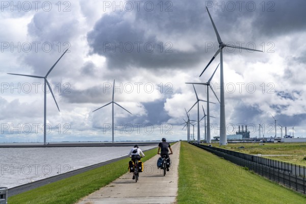 Strekdammen Wind Farm, wind farm at the seaport of Eemshaven in the Netherlands, left, built on