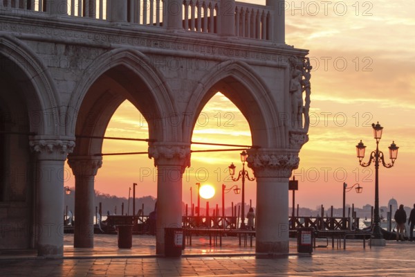 Sunrise at the Piazzetta in the morning during the Acqua alta, Venice, Veneto, Italy