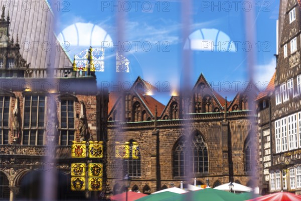 Cherry nave of the Church of Our Lady, Town Hall and German House Market (right) reflected in the