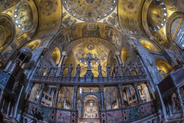 Wide angle view of the richly decorated interior of saint mark's basilica, highlighting the