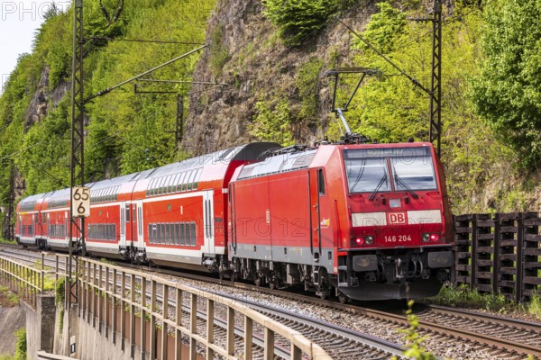 Regional express RE5 en route on the winding railway line of the Geislinger Steige. Landscape along