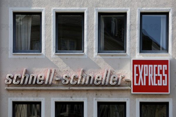Writing on a wall of a house fast fast express, German newspaper, regional tabloid, Bonn, North