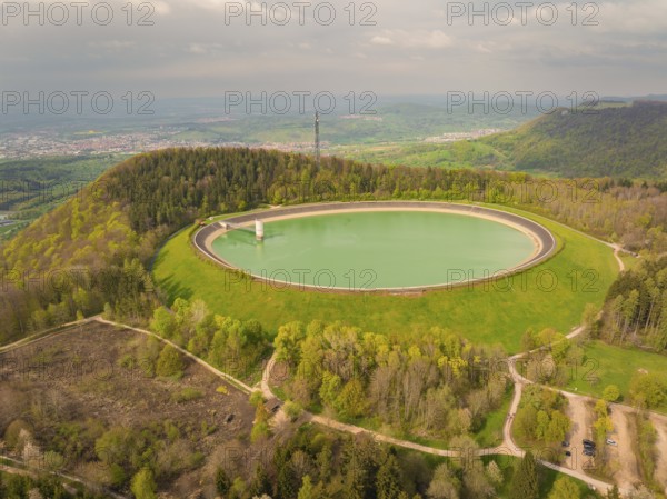 Upper reservoir, landscape with reservoir and forest on a hill, observation tower in the