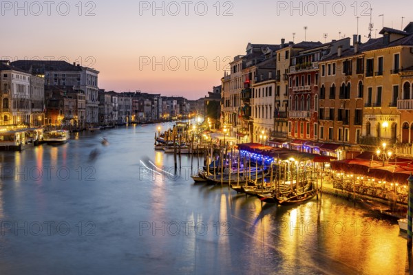 View of the Grand Canal at the blue hour, picturesque evening mood with illuminated palazzos on the