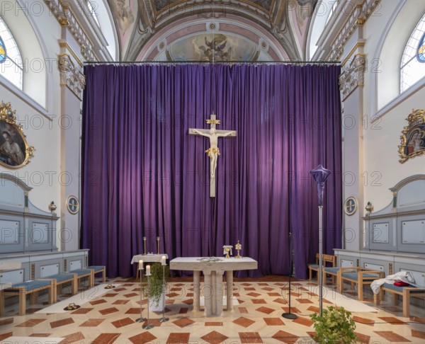 Large purple Lenten cloth in front of the high altar in the baroque parish church of St Nicholas,