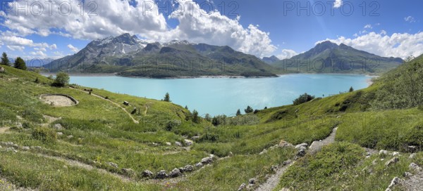 Panoramic view of Jardin Alpin in the foreground, Lac du Mont Cenis reservoir behind, Mont Cenis