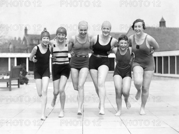 Group of woman in swimwear on a jetty, 1930s, woman in swimming costumes smiling and posing happily