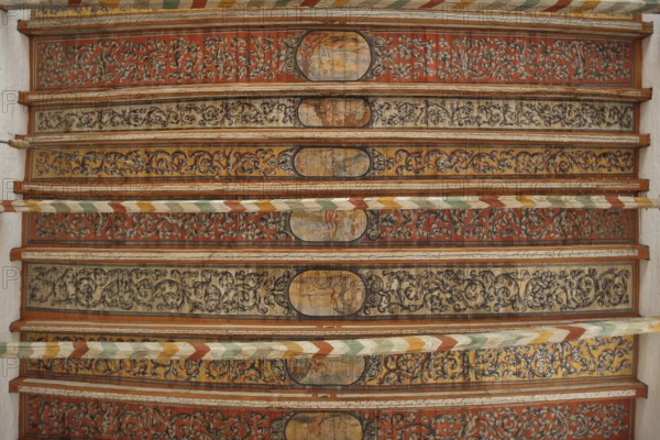 Wooden ceiling with wood carving and painting from the 17th century, interior view, wooden beams,