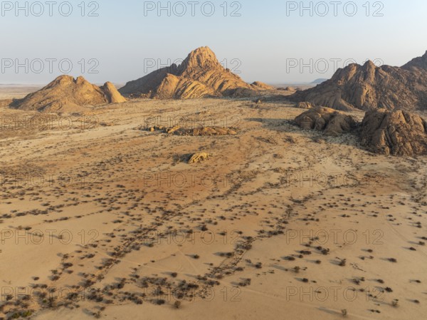 The isolated Spitzkoppe mountain (1728 m) majestically rises above the surrounding desert plains.