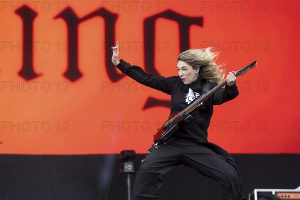 Daniela Villarreal Vélez, singer of The Warning is surprised by a gust of wind at the Rock am Ring