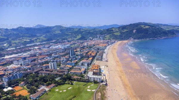 Aerial perspective of zarautz, gipuzkoa, showcasing the urban landscape meeting the sandy beach and