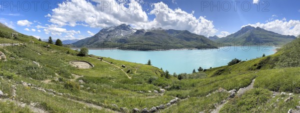Panoramic view of Jardin Alpin in the foreground, Lac du Mont Cenis reservoir behind, Mont Cenis