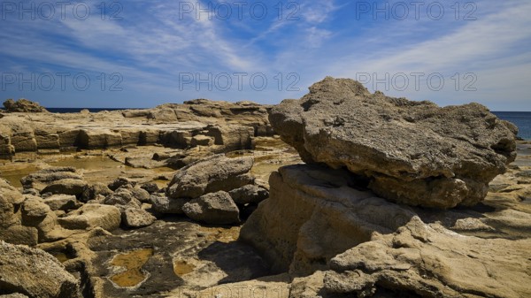 Large rocks along the coast under a clear sky, Oasis Beach, East Coast Rhodes, Rhodes, Dodecanese,