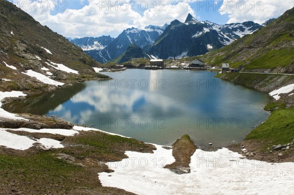 View from Swiss territory to Italian territory over mountain lake Lac du Grand Saint Bernard on top