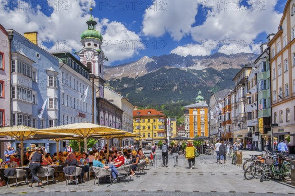 Street café on the pedestrian zone Maria-Theresien-Strasse in front of the Nordkette of the