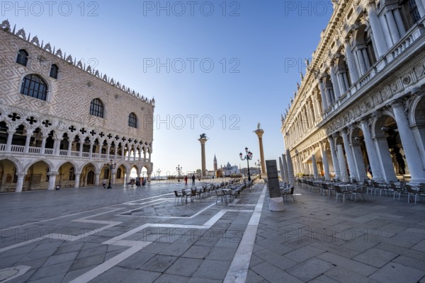 Chairs and tables of cafes at Piazetta San Marco, Doge's Palace and Colonna di San Marco and
