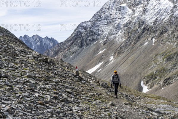 Mountaineer on a rocky hiking trail, ascent to the summit of Böses Weibl, Wiener Höhenweg, Schober