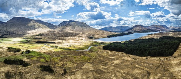 Panorama of Mountains and Moors over Loch Tulla and River Orchy from a drone, Highlands, Scotland,