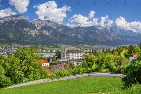 Ambras Castle on the outskirts of the city in front of the northern range of the Karwendel