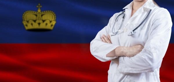 Doctor with crossed arms on Liechtenstein flag. Liechtenstein health and care concept. Female