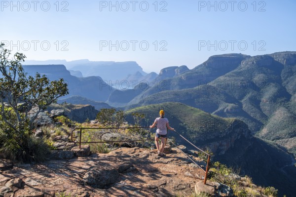 Tourist at the viewpoint, view of the Blyde River gorge, Lowveld Viewpoint, in the evening light,