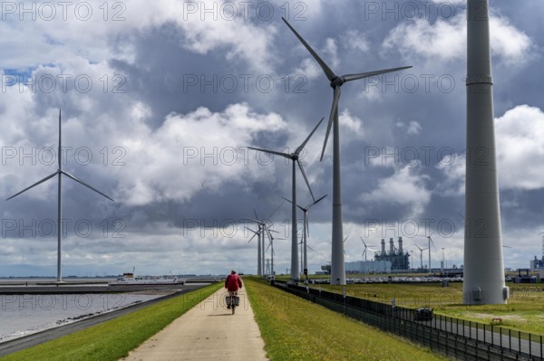 Strekdammen Wind Farm, wind farm at the seaport of Eemshaven in the Netherlands, left, built on