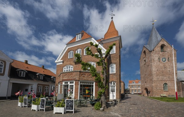 Historic brick building with street café, next to church, Old Town, Ringkøbing, Ringkøbing Fjord,