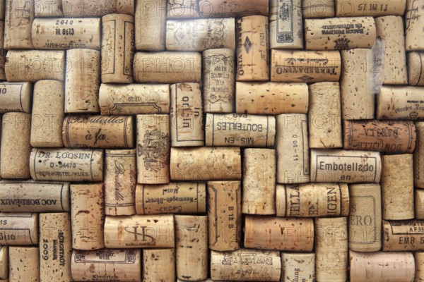 Corks from wine bottles laid as a regular pattern, wine corks, red wine