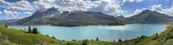 Panoramic view from plateau above Lanslebourg-Mont-Cenis with pass road to pass Alpine pass
