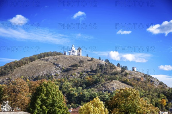 A chapel on a hill with soft autumn colours under a clear blue sky, Mikulov Nikolsburg Czech