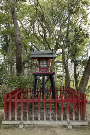 Inari-jinja Shrine on Mount Kifuku in Shukkei-en with blossoming cherry trees, sakura, and