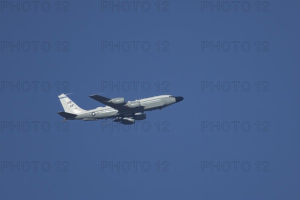 RC-135W Rivet Joint military jet aircraft of the United States Air Force USAF flying, England,
