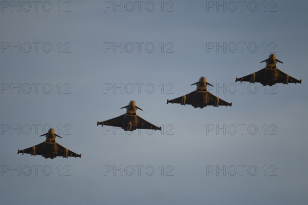 Eurofighter Typhoon four military fighter jet aircraft of the Royal air force RAF flying in