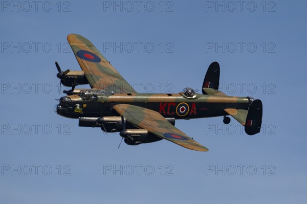 Avro Lancaster warbird military aircraft in Royal air force RAF colours flying, England, United
