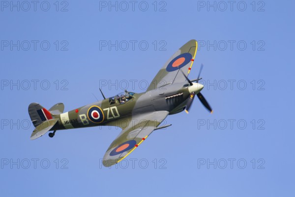 Supermarine Spitfire warbird military aircraft in Royal air force RAF colours flying, England,
