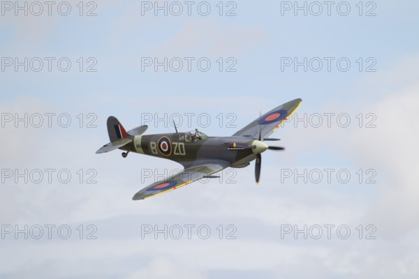 Supermarine Spitfire warbird military aircraft in Royal air force RAF colours flying, England,