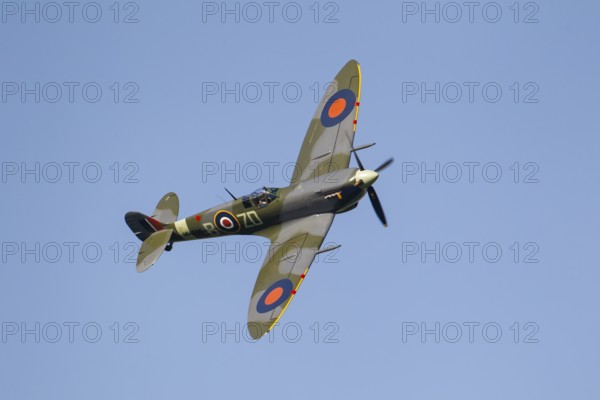 Supermarine Spitfire warbird military aircraft in Royal air force RAF colours flying, England,