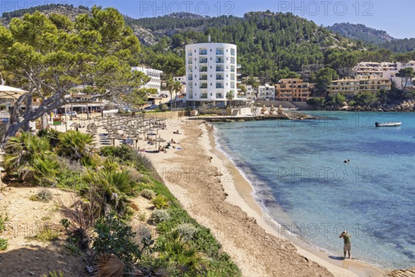 Scenics view at a coast village at the Mediterranean Sea with a sand beach and hotels by the sea at