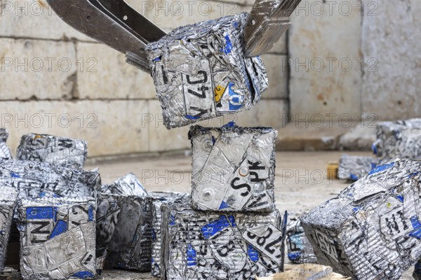 Cubes made from scrap metal, disused car licence plates. Symbolic photo. Stuttgart,