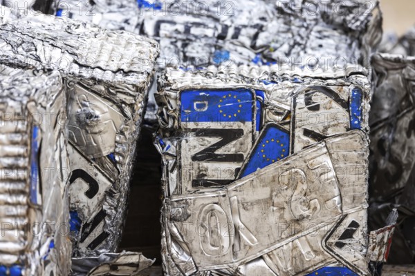 Cubes made from scrap metal, disused car licence plates. Symbolic photo. Stuttgart,
