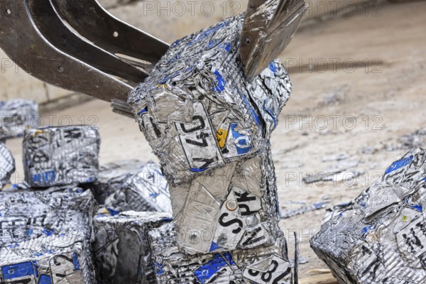 Cubes made from scrap metal, disused car licence plates. Symbolic photo. Stuttgart,