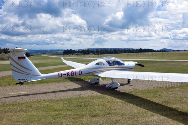 Motorised glider taxiing to the runway at Wasserkuppe airfield, Rhön, Gersfeld, Fulda district,