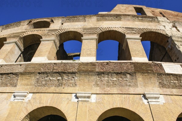 Steep view upwards to partially restored façade Exterior façade with large arched windows Brick
