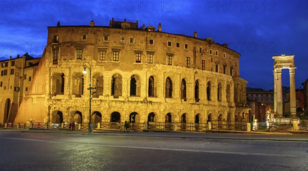 View at dusk blue hour on the left illuminated historical Marcellus Theatre Theatre of Marcellus on