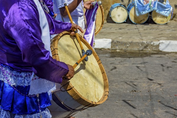 Congado parade with musicians and their drums and colorful clothes on the streets of Belo