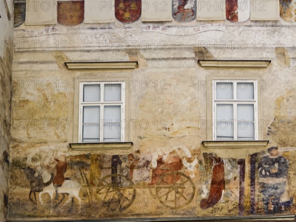 Faded medieval wall painting with windows and decorative elements Göglhaus Old Town Krems Wachau