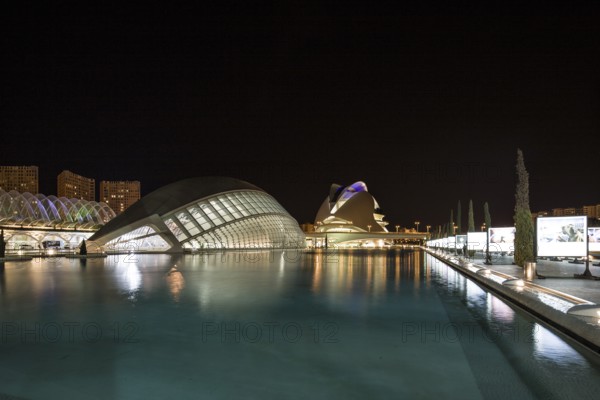 Valencia Spain Nocturnal urban scenery with illuminated modern buildings and water City of Arts and