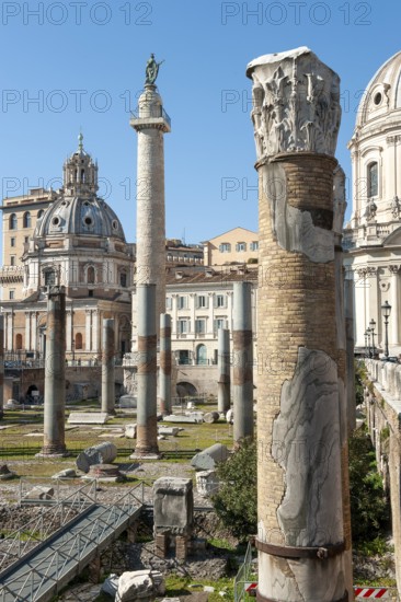 View of part of historic Trajan's Forum with ancient column fragments in front, behind it 40 metre