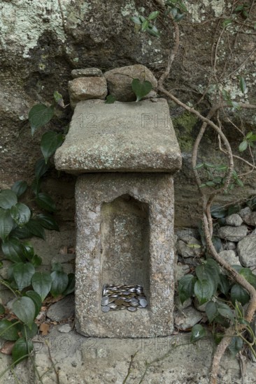 Small stone house for offerings with yen coins on the Shariki-michi Trail to Mount Nokogiri, Mount